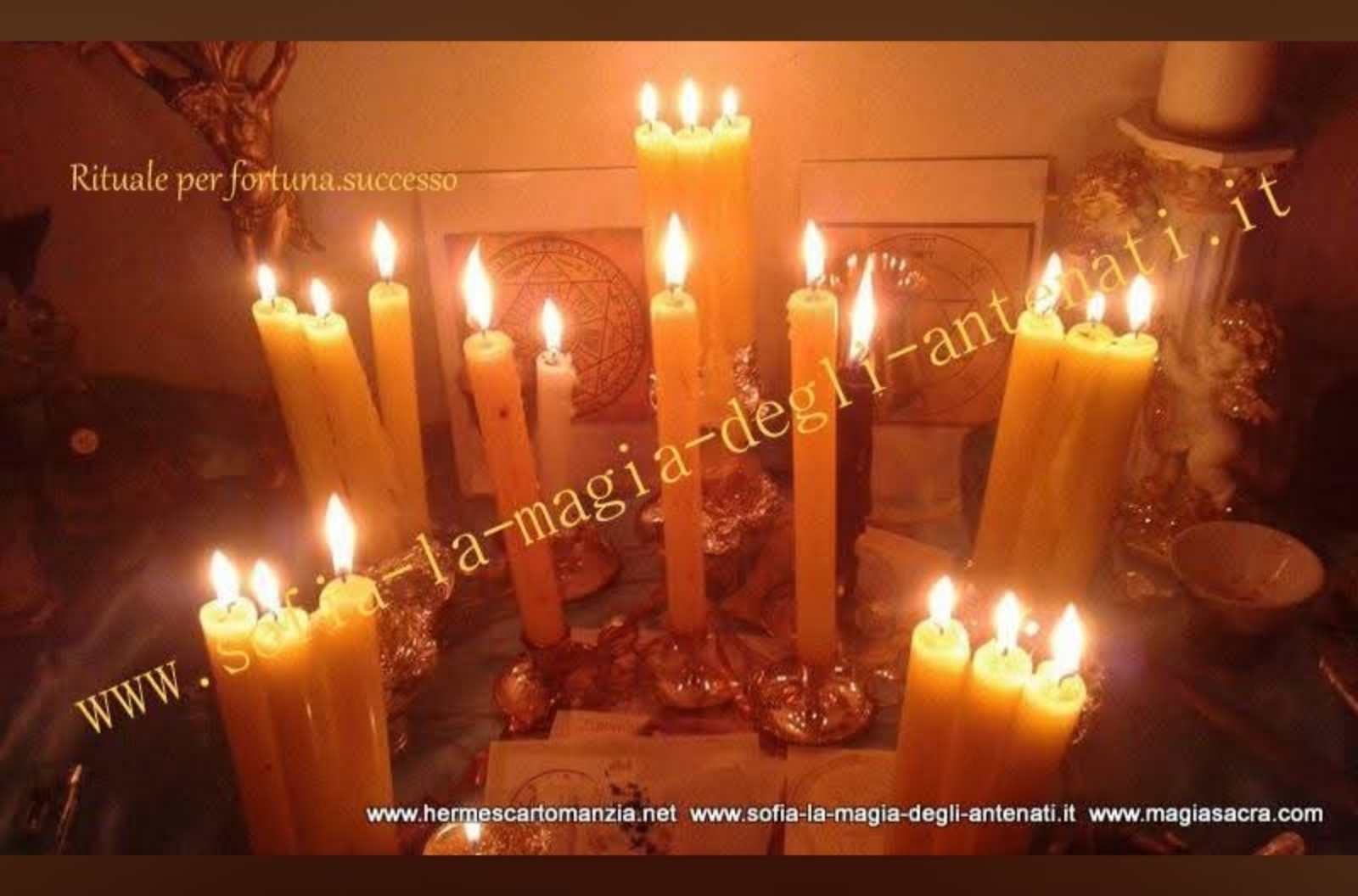 A warm, candlelit tabletop arrangement featuring tall yellow candles, decorative objects and promotional watermarks.