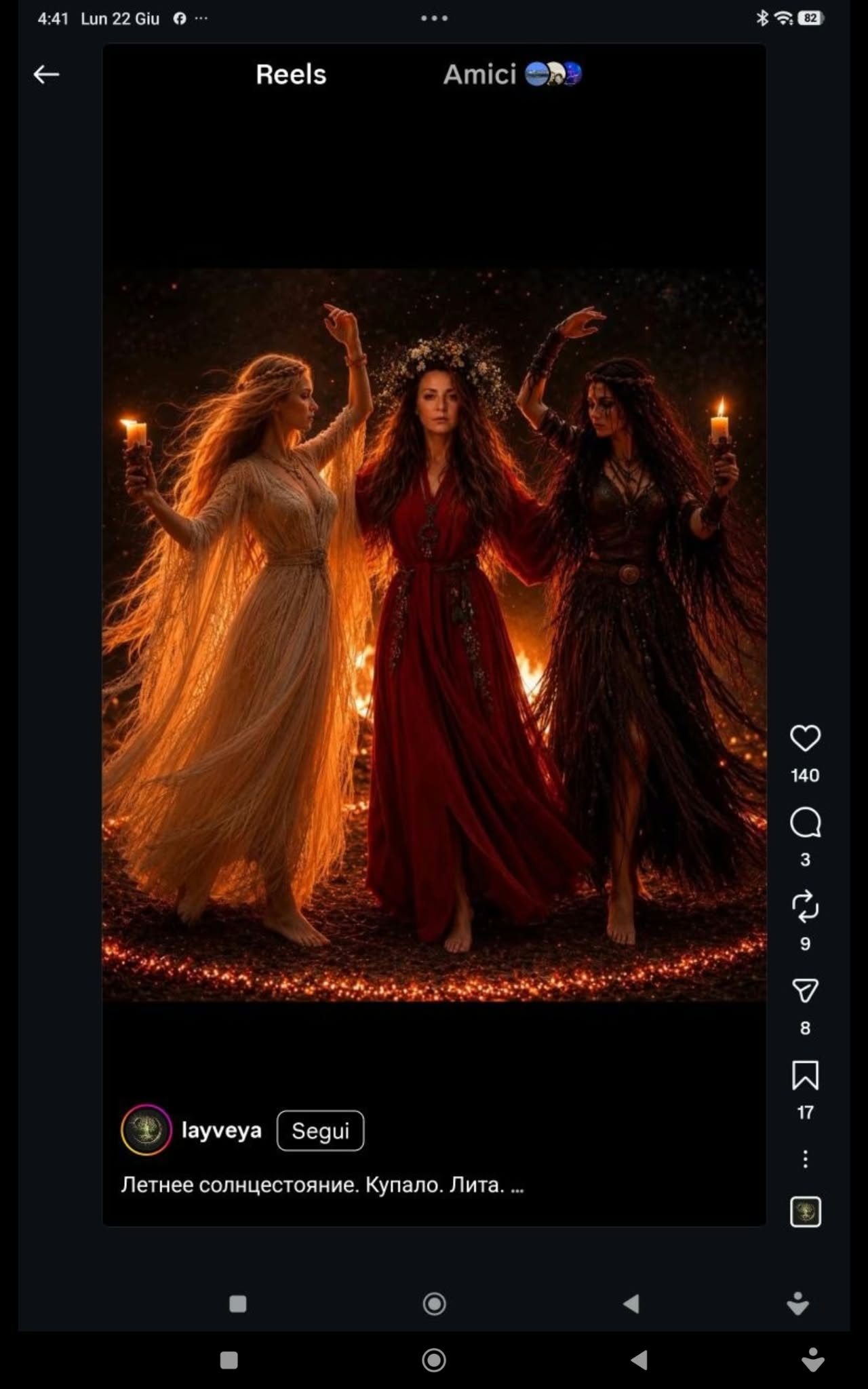 Three women in flowing dresses standing together in a dark setting with flames, shown full-length under dramatic orange lighting.